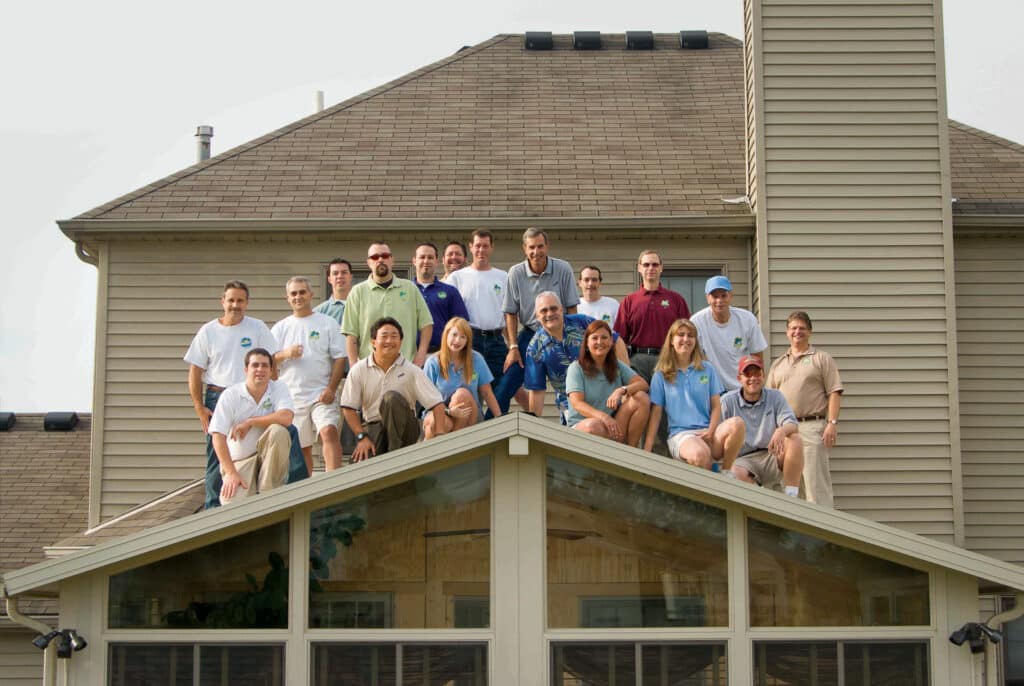 Joyce manufacturing team on top of sunroom roof