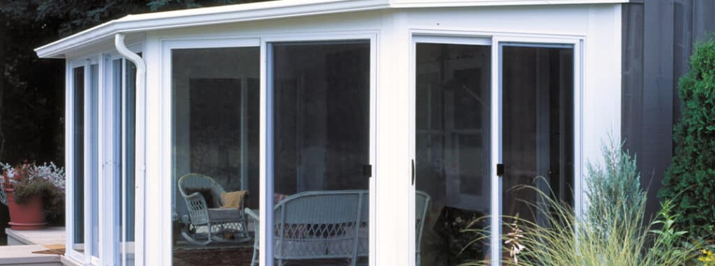 White sunroom addition to home