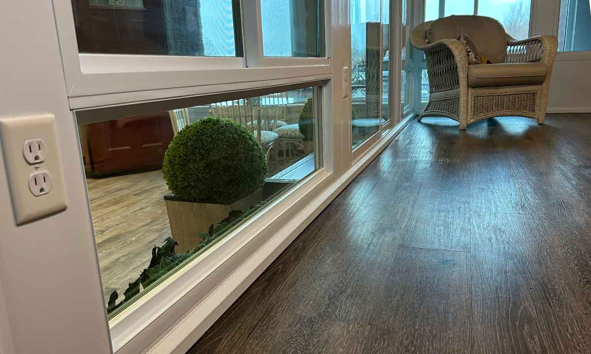 Sunroom with windows and plant outside