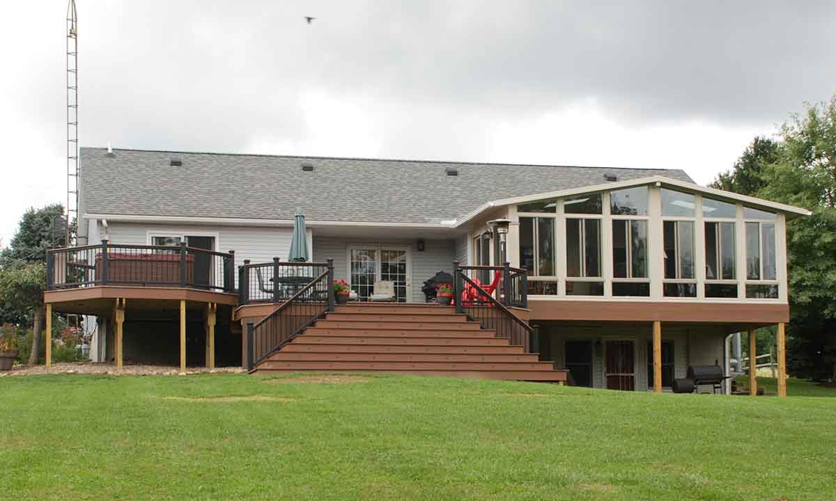 Outdoor deck steps leading to newly built sunroom