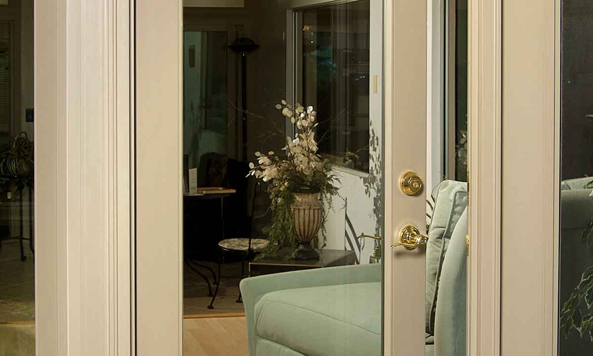 Sunroom with living area and patio door