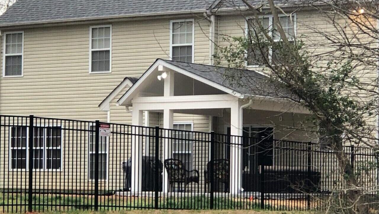 Outdoor view of house with patio cover