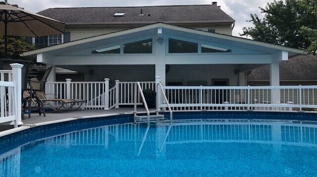 Patio cover behind swimming pool