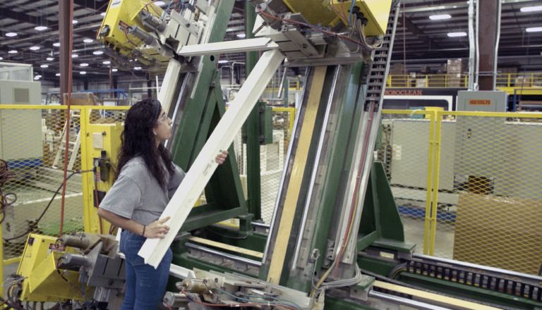 Factory employeee at Joyce manufacturing using welding machine
